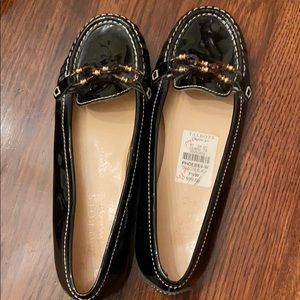 Black Patent Leather Loafer. Tortoise shell buckle